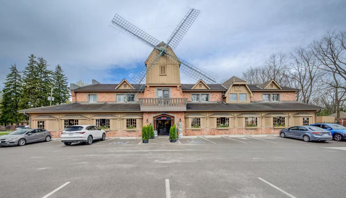 The Windmill Country Market, a long brick building topped with a windmill